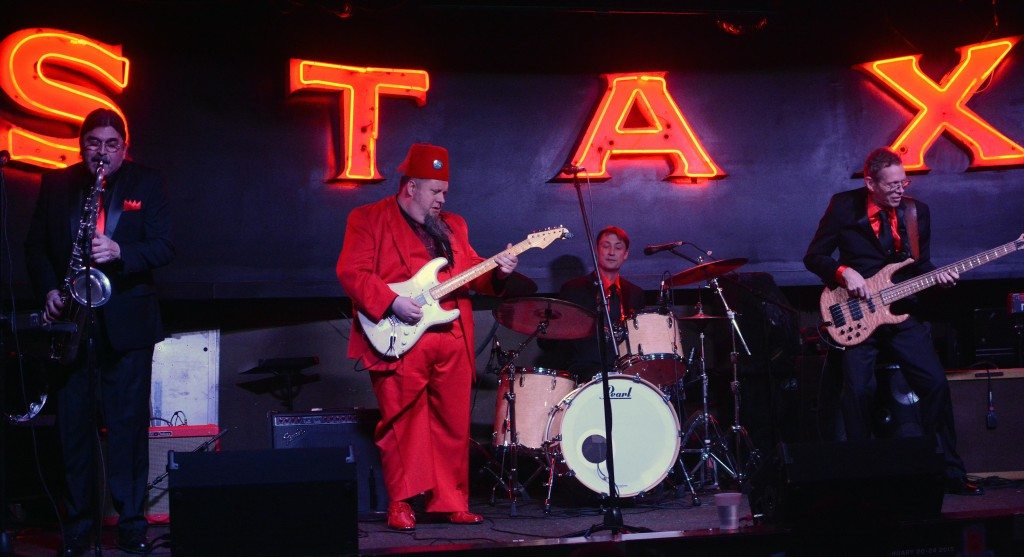 The bandleader of the C.D. Woodbury Band dons a fez for the crowd at Alfred's in Memphis.