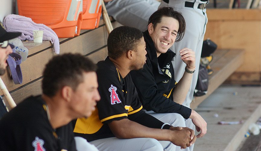 Lincecum chats with Bees left fielder Sherman Johnson in the dugout. "It’s refreshing, to say the least, because it’s a different style of baseball that’s being played down here," Lincecum said after the game. "I think it’s a lot more heartfelt, so you feel that in the dugout."