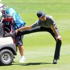 Steph Curry stretches out his right knee on the 16th fairway at Edgewood Tahoe Golf Course on Thursday. Tahoe Onstage photos by Tim Parsons