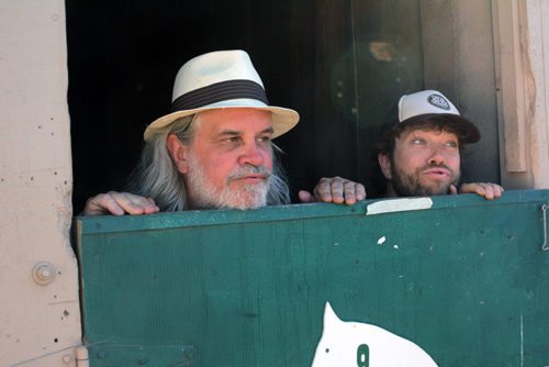 Andy Thorn, risht, hang out in a horse stall at the High Sierra Music Festival with bandmate Vince Herman. Tim Parsons / Tahoe Onstage